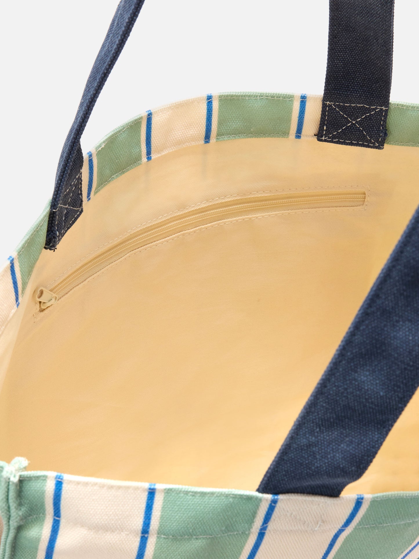 Essenzielle Canvas-Tragetasche mit grünen, hellblauen und weißen Streifen und kontrastierendem Logo