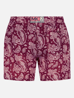 Man light fabric swim shorts with burgundy paisley print