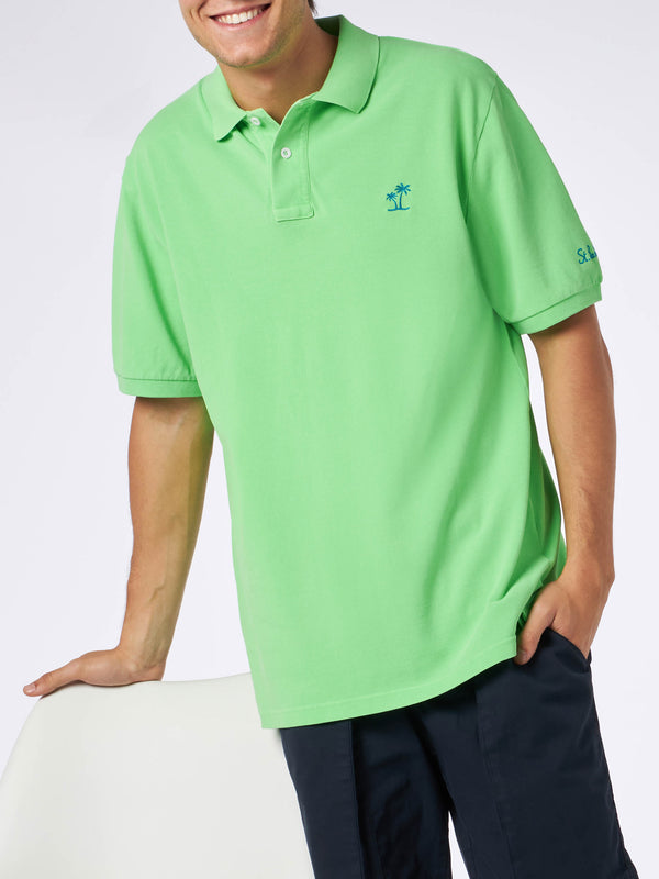 Polo da uomo in piquet verde fluo con logo St. Barth ed effetto vintage