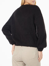 Woman boxy shape soft sweater with Somebody to Love embroidery and crochet hearts patch