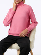 Woman knitted pink turtleneck sweater