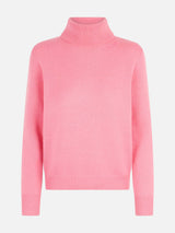 Woman knitted pink turtleneck sweater