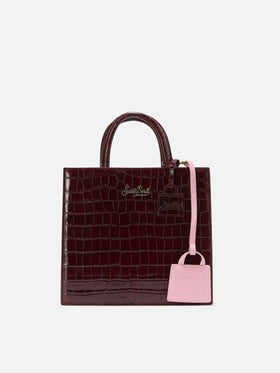 Bag charm in pelle liscia rosa chiaro con logo impresso