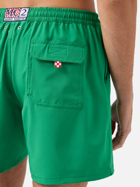 Comfort swim shorts in green with Faccio tutto a fin di bere embroidery