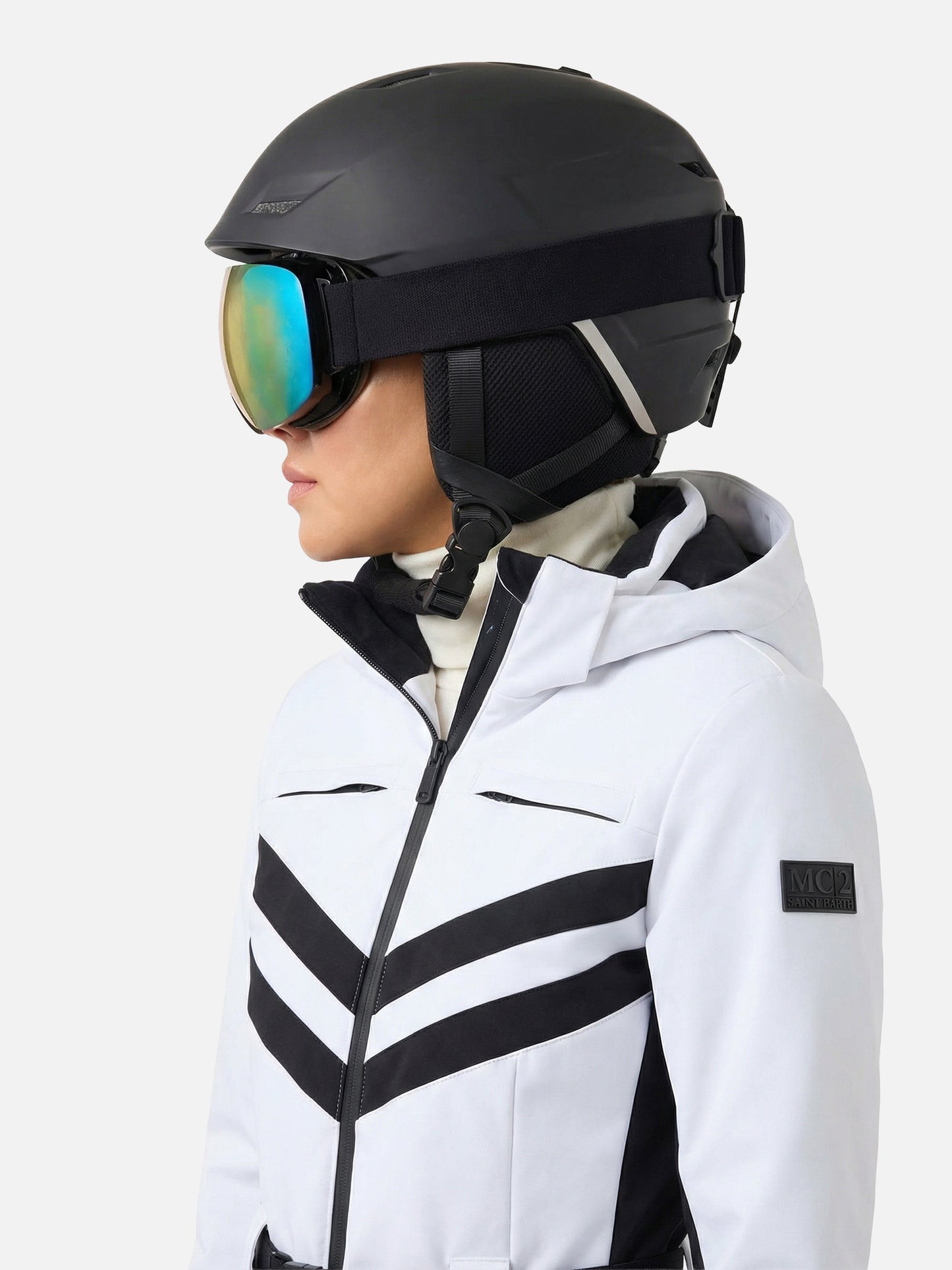Woman white ski suit Garmisch with RECCO® technology