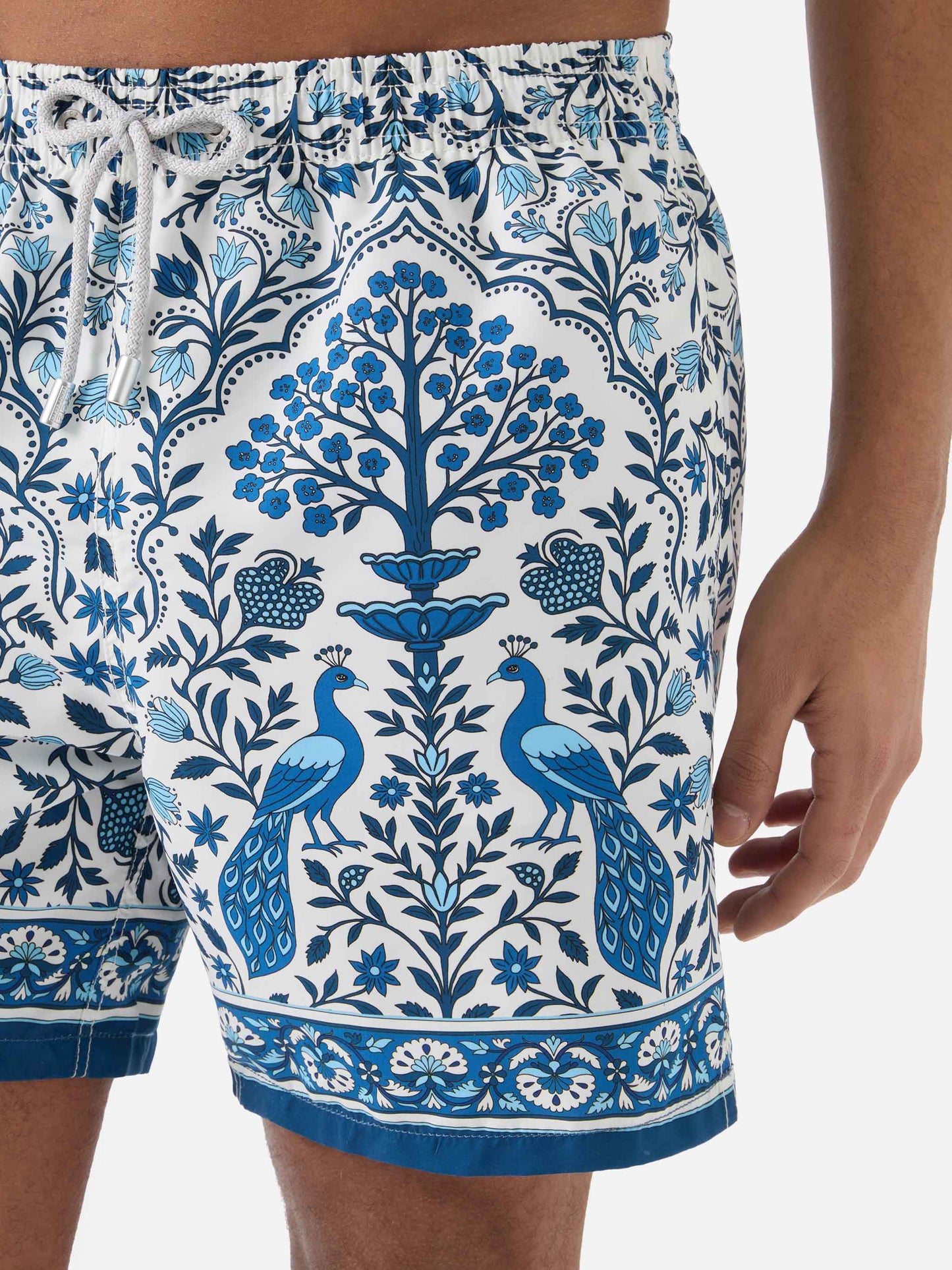 Gustavia white swim shorts with contrasting peacock print