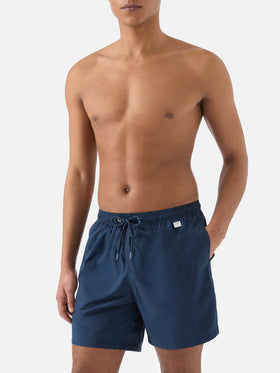 Lighting Pantone swim shorts in solid dark blue | Special Edition
