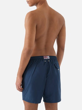 Lighting Pantone swim shorts in solid dark blue | Special Edition