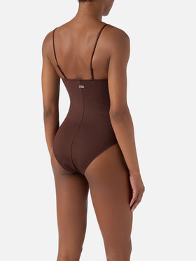 Medea one-piece swimsuit in brown with beaded sea-themed decorations