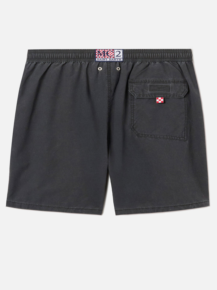 Patmos swim shorts in black with used effect and logo embroidery