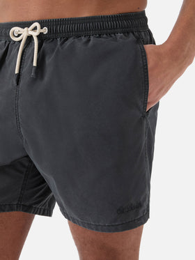 Patmos swim shorts in black with used effect and logo embroidery