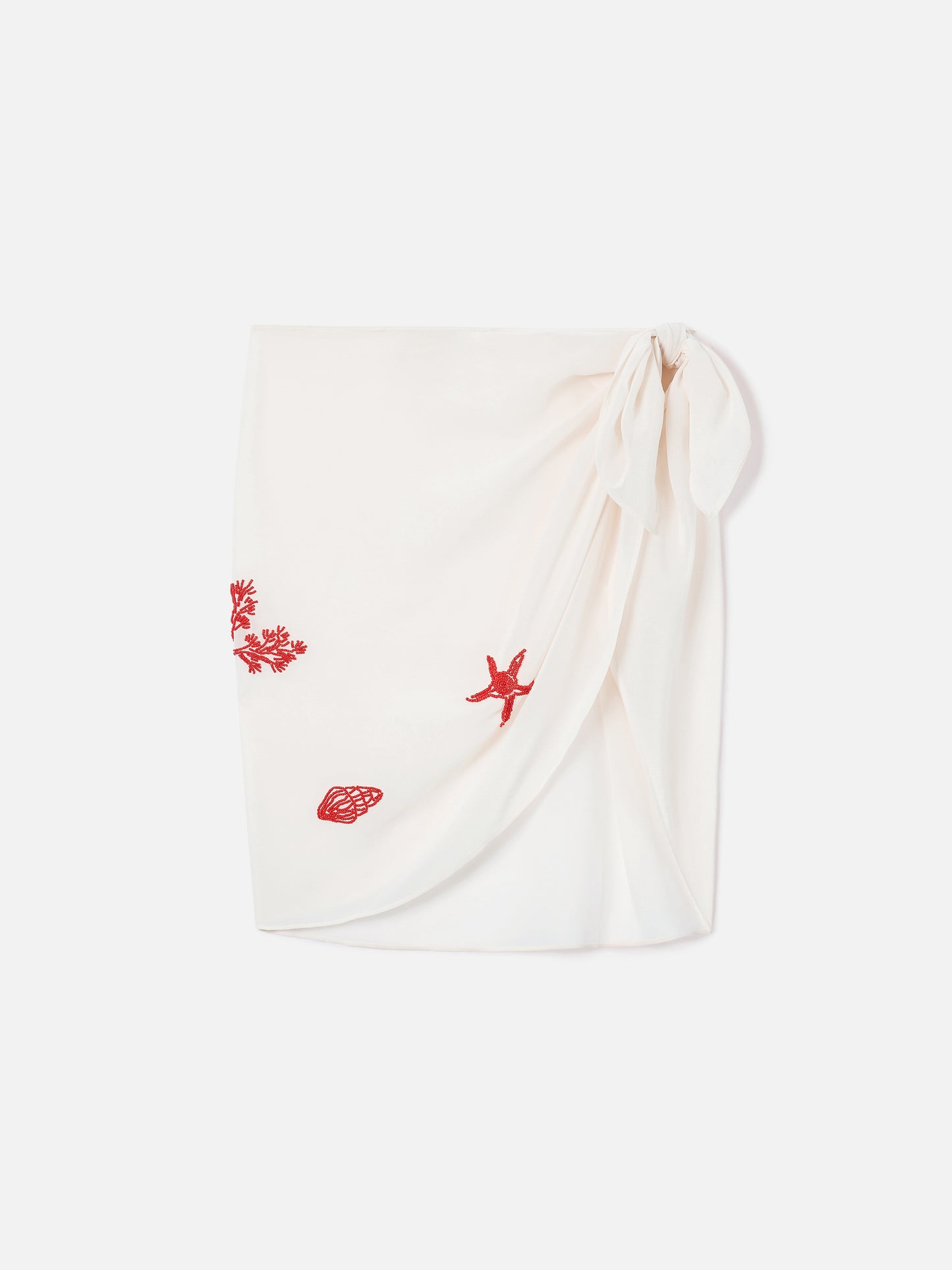 Sery short pareo in cream with beaded sea-themed decorations