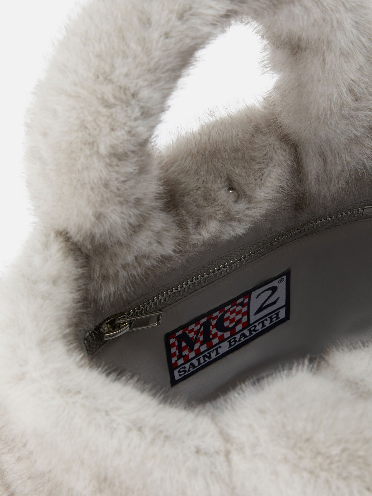 Borsa Mini Vanity Soft grigia in effetto pelliccia con ricamo logo