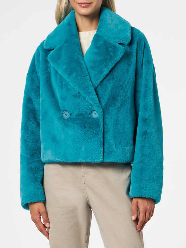 Woman furry short teal jacket