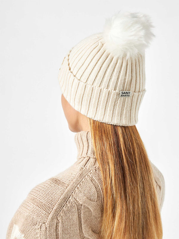 Woman white beanie with pompon