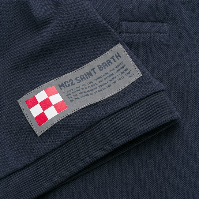 Blue piquet polo with St. Barth check logo