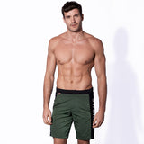 Military green swim shorts with contrast lateral band