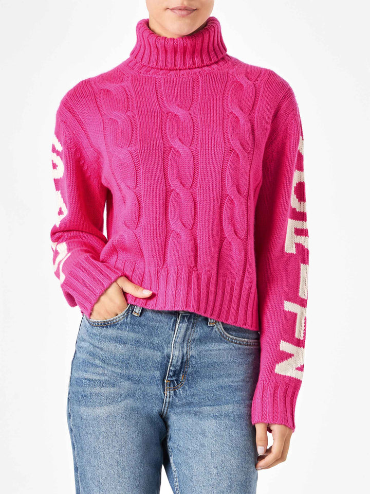Woman fluo pink turtleneck braided sweater