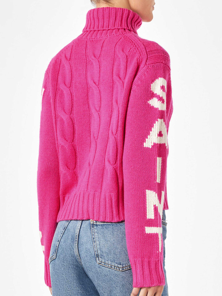 Woman fluo pink turtleneck braided sweater